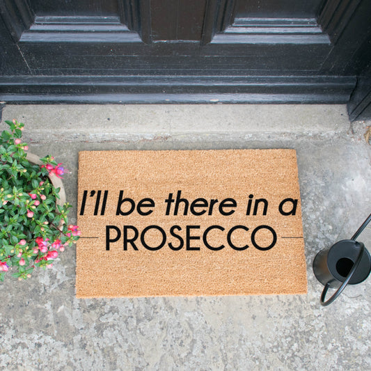 'I'll Be There In A Prosecco' Welcome Doormat