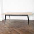 Oak Extendable Dining Table with Matte Black Legs and Gold Accents